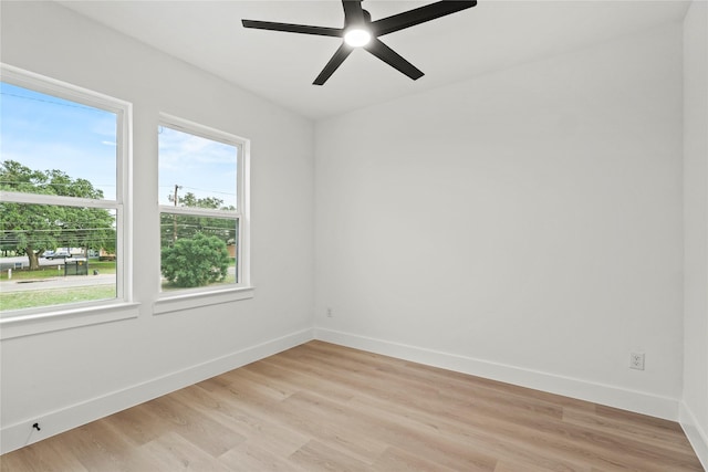 4523 Wahoo St, Dallas, TX 75210 - unfurnished room featuring light wood-style flooring, baseboards, and a ceiling fan