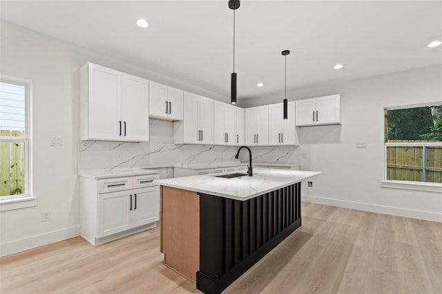 4523 Wahoo St, Dallas, TX 75210 - kitchen featuring a sink, recessed lighting, light stone countertops, tasteful backsplash, and light wood-style flooring