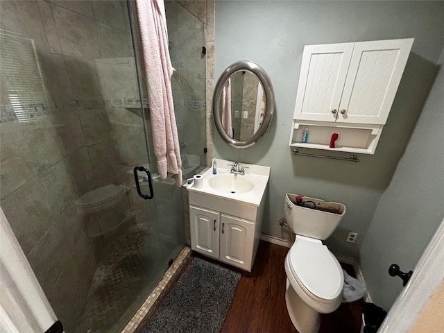 17624 Fm 1255, Canton, TX 75103 - bathroom featuring toilet, a stall shower, vanity, and wood finished floors