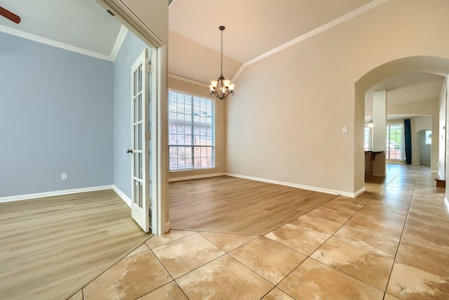 2128 Chambers Dr, Allen, TX 75013 - unfurnished room featuring ornamental molding, arched walkways, light tile patterned floors, a chandelier, and vaulted ceiling