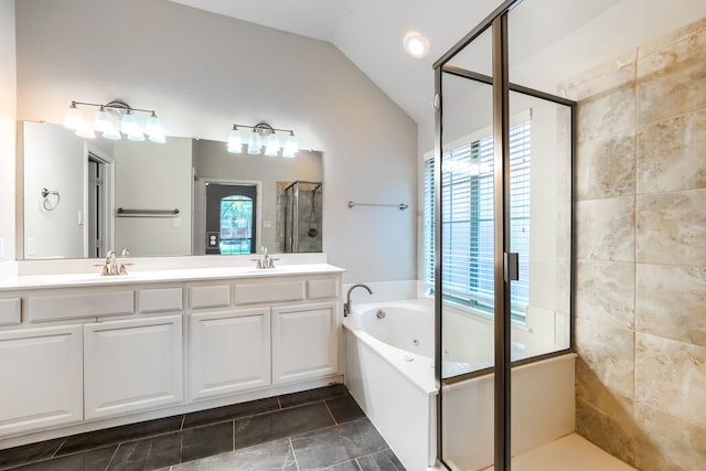 2128 Chambers Dr, Allen, TX 75013 - bathroom featuring a stall shower, vaulted ceiling, double vanity, a whirlpool tub, and tile patterned floors