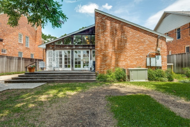 4229 Colgate Ave, University Park, TX 75225 - rear view of house featuring french doors, a wooden deck, and brick siding