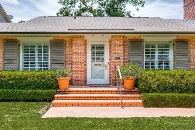 4229 Colgate Ave, University Park, TX 75225 - doorway to property featuring brick siding and a shingled roof