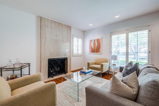4229 Colgate Ave, University Park, TX 75225 - living room featuring wood finished floors, a large fireplace, recessed lighting, and baseboards