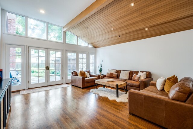 4229 Colgate Ave, University Park, TX 75225 - living area featuring french doors, wood finished floors, beam ceiling, high vaulted ceiling, and recessed lighting