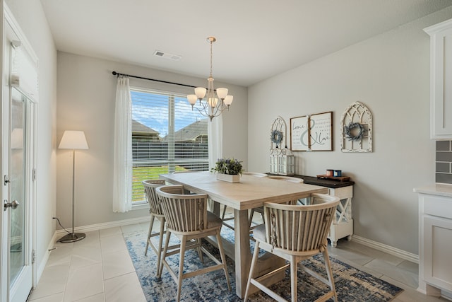 7020 Cross Point Ln, Little Elm, TX 76227 - dining space featuring a chandelier, baseboards, and light tile patterned floors