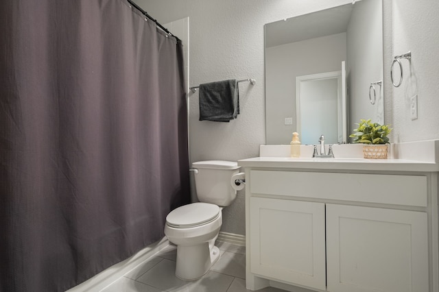 7020 Cross Point Ln, Little Elm, TX 76227 - full bathroom featuring toilet, tile patterned floors, vanity, a textured wall, and a shower with shower curtain