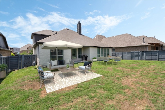 7020 Cross Point Ln, Little Elm, TX 76227 - rear view of house featuring a chimney, brick siding, a patio area, and an outdoor living space