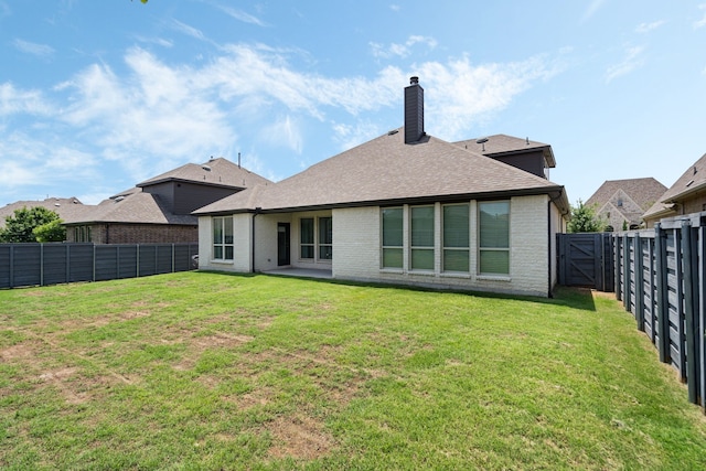 7020 Cross Point Ln, Little Elm, TX 76227 - back of house with brick siding, a chimney, and a shingled roof