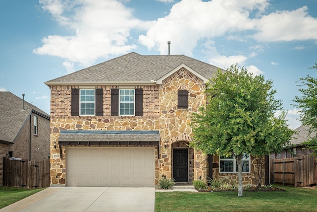 1205 Glacier Ct, Celina, TX 75009 - view of front of property featuring stone siding, driveway, a shingled roof, and a garage
