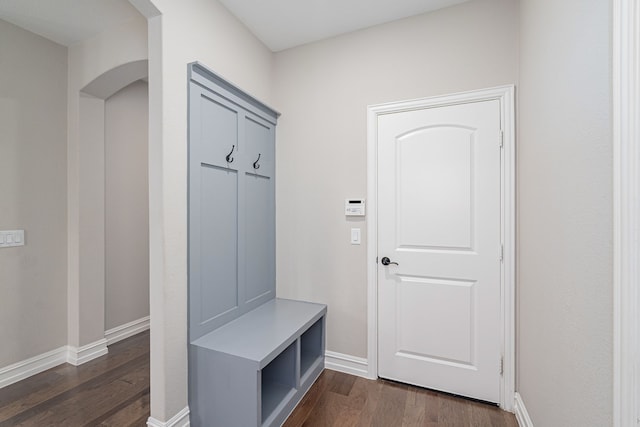 1205 Glacier Ct, Celina, TX 75009 - mudroom featuring dark wood finished floors, baseboards, and arched walkways