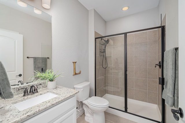 1205 Glacier Ct, Celina, TX 75009 - full bath featuring vanity, toilet, tiled shower, and tile patterned floors