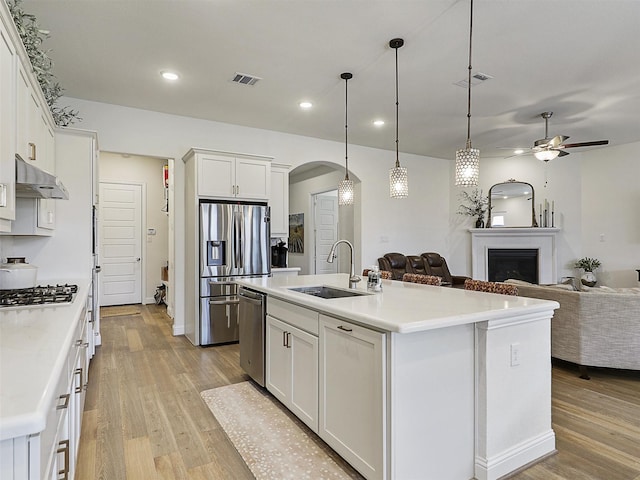 2624 Bellevue, The Colony, TX 75056 - kitchen featuring appliances with stainless steel finishes, a sink, open floor plan, a ceiling fan, and recessed lighting