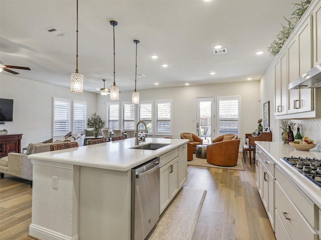 2624 Bellevue, The Colony, TX 75056 - kitchen with open floor plan, ceiling fan, appliances with stainless steel finishes, and recessed lighting