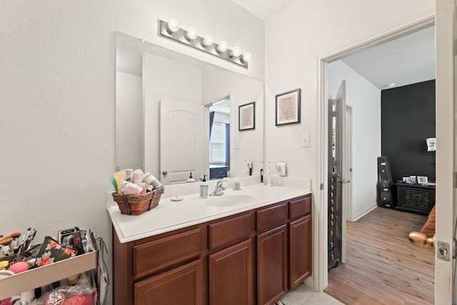 1615 White Mountain Way, Princeton, TX 75407 - bathroom with vanity and wood finished floors