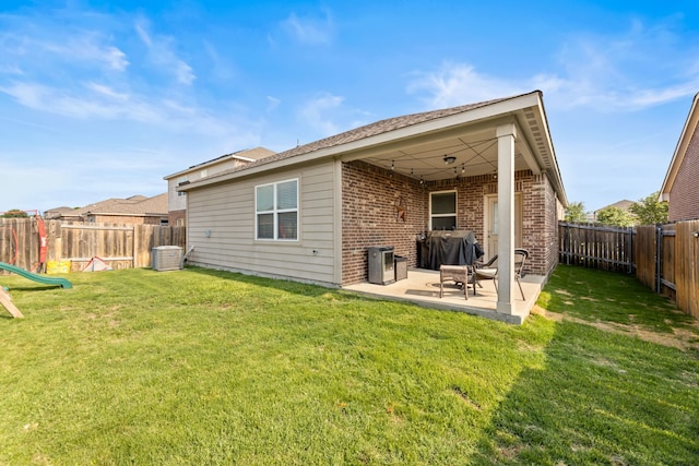 1615 White Mountain Way, Princeton, TX 75407 - rear view of property with brick siding and a patio area
