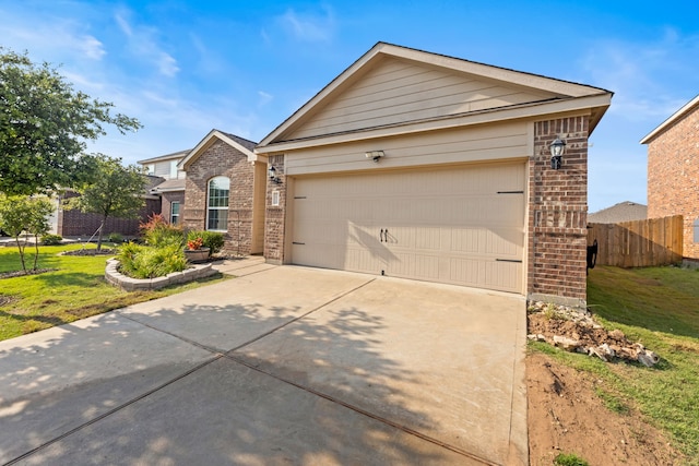 1615 White Mountain Way, Princeton, TX 75407 - view of front facade with brick siding, concrete driveway, and a garage