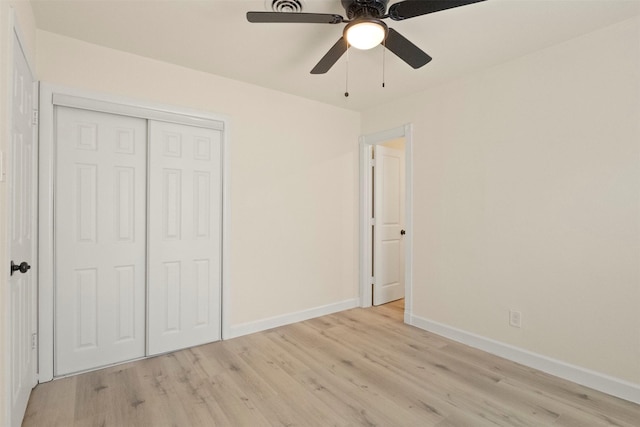 2810 Altman Dr, Irving, TX 75062 - unfurnished bedroom featuring baseboards, light wood-type flooring, a closet, and a ceiling fan
