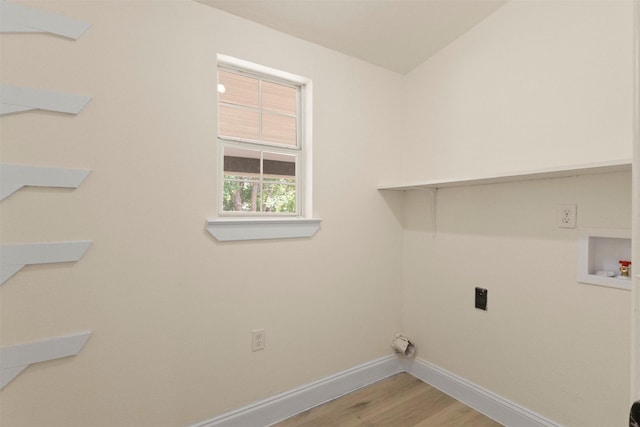 2810 Altman Dr, Irving, TX 75062 - laundry area with washer hookup, baseboards, electric dryer hookup, and light wood finished floors