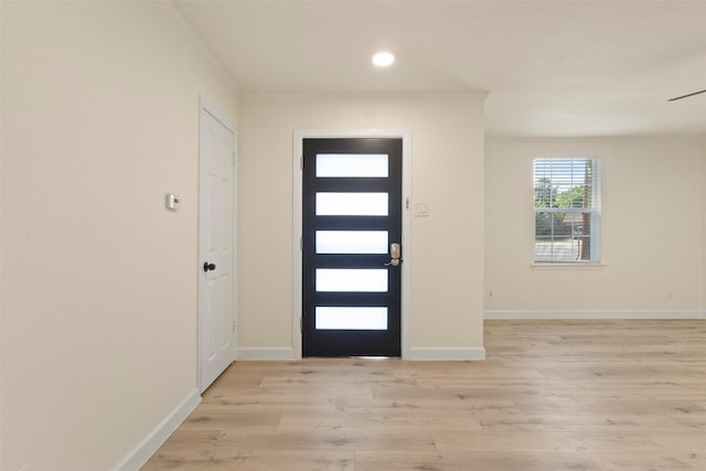 2810 Altman Dr, Irving, TX 75062 - foyer entrance featuring light wood-style floors, baseboards, and recessed lighting