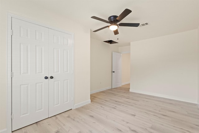 2810 Altman Dr, Irving, TX 75062 - unfurnished bedroom featuring light wood-style floors, baseboards, a closet, and ceiling fan