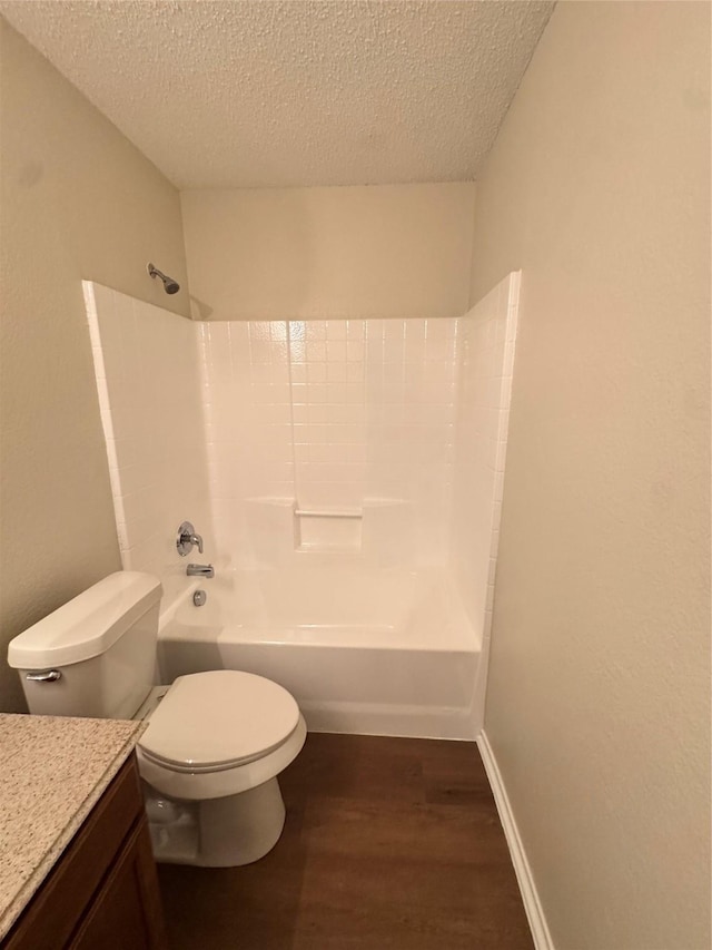 195 Rolling Ct, Lancaster, TX 75146 - full bath featuring wood finished floors, vanity, toilet, washtub / shower combination, and a textured ceiling