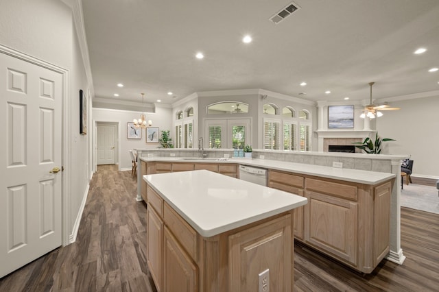324 Lakeside Oaks Cir, Lakeside, TX 76135 - kitchen featuring a large island, light brown cabinetry, a sink, recessed lighting, and a fireplace