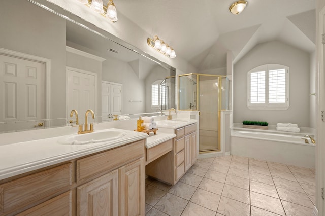 324 Lakeside Oaks Cir, Lakeside, TX 76135 - bathroom with vaulted ceiling, double vanity, a bath, a shower stall, and healthy amount of natural light