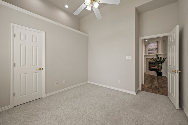 324 Lakeside Oaks Cir, Lakeside, TX 76135 - spare room featuring carpet flooring, ceiling fan, baseboards, recessed lighting, and a fireplace