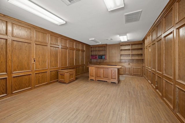 324 Lakeside Oaks Cir, Lakeside, TX 76135 - unfurnished office featuring light wood finished floors, a decorative wall, wooden walls, and built in features