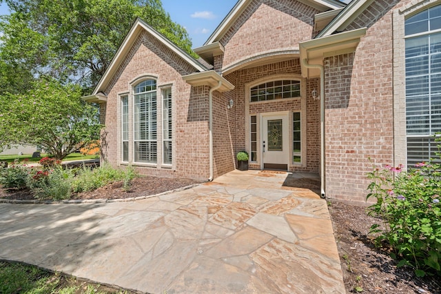 324 Lakeside Oaks Cir, Lakeside, TX 76135 - entrance to property featuring brick siding and a patio