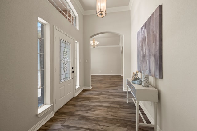 324 Lakeside Oaks Cir, Lakeside, TX 76135 - entryway with arched walkways, ornamental molding, a chandelier, baseboards, and dark wood-style flooring