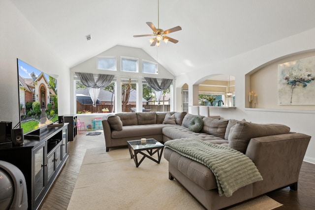 4206 Creekbluff Dr, Rowlett, TX 75088 - living room featuring ceiling fan, wood finished floors, high vaulted ceiling, a chandelier, and arched walkways