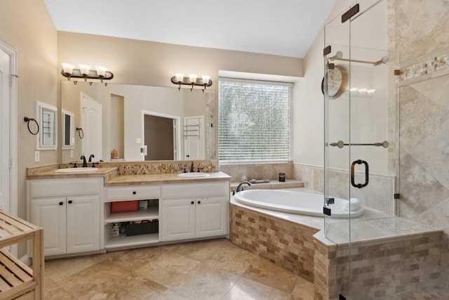 4206 Creekbluff Dr, Rowlett, TX 75088 - bathroom with double vanity, a bath, a shower stall, tile patterned floors, and lofted ceiling