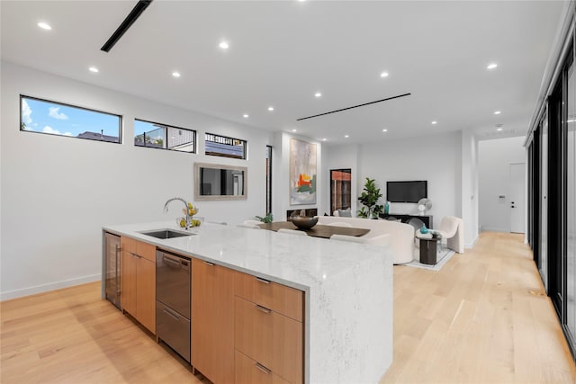5029 Pershing St, Dallas, TX 75206 - kitchen featuring a sink, modern cabinets, stainless steel dishwasher, beverage cooler, and light wood-style flooring