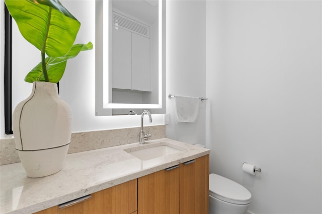 5029 Pershing St, Dallas, TX 75206 - half bathroom with vanity and toilet