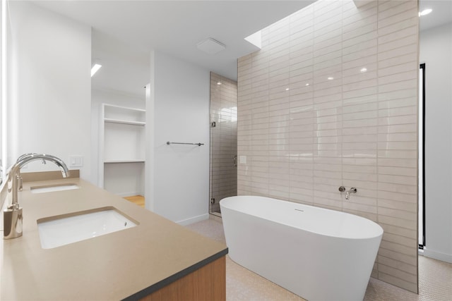 5029 Pershing St, Dallas, TX 75206 - full bathroom featuring double vanity, a freestanding bath, built in shelves, and baseboards