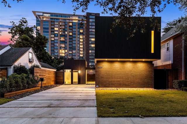 5029 Pershing St, Dallas, TX 75206 - modern home featuring concrete driveway and brick siding