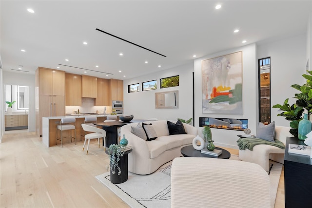5029 Pershing St, Dallas, TX 75206 - living area with light wood-style floors and recessed lighting