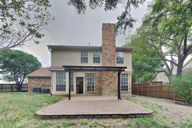 1701 Shiprock Dr, Plano, TX 75025 - back of house with brick siding, a fenced backyard, cooling unit, and a patio area