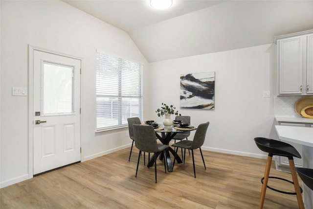 211 Windsong Way, Allen, TX 75002 - dining room with light wood-style flooring, plenty of natural light, vaulted ceiling, and baseboards