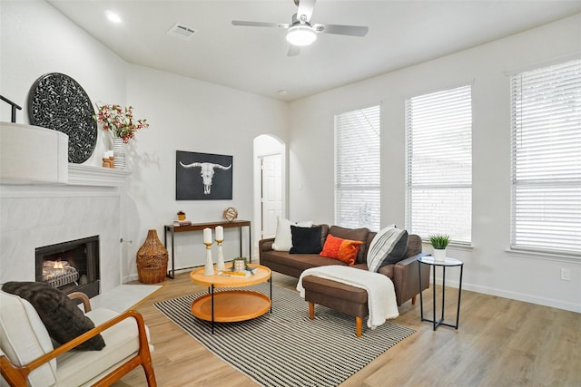 211 Windsong Way, Allen, TX 75002 - living area with light wood-type flooring, a ceiling fan, and healthy amount of natural light