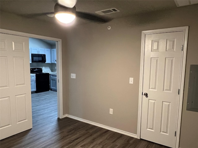 6108 Abrams Rd Unit 215, Dallas, TX 75231 - empty room with dark wood-type flooring, a ceiling fan, baseboards, and electric panel