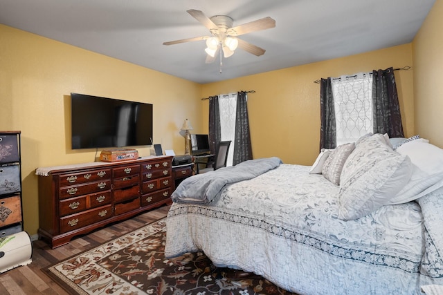 419 NW Murphy Rd, Burleson, TX 76028 - bedroom with multiple windows, wood finished floors, and ceiling fan