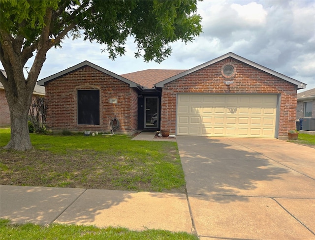 419 NW Murphy Rd, Burleson, TX 76028 - single story home featuring brick siding, an attached garage, driveway, and a front yard