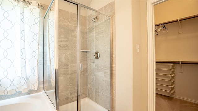 4100 Fanita Pl, Denton, TX 76210 - full bath with a walk in closet, a stall shower, and a bath