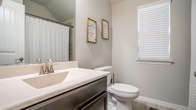 4100 Fanita Pl, Denton, TX 76210 - full bathroom featuring toilet, vanity, wood finished floors, and lofted ceiling