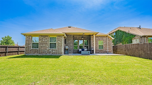 4100 Fanita Pl, Denton, TX 76210 - back of house featuring a ceiling fan, a patio area, and brick siding