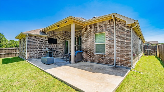 4100 Fanita Pl, Denton, TX 76210 - back of property with brick siding, cooling unit, and a patio area