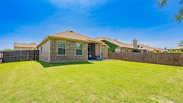 4100 Fanita Pl, Denton, TX 76210 - back of house with brick siding and a patio area